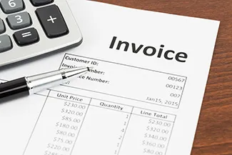 Invoice with a calculator and pen