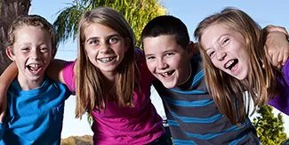 Elementary school aged kids smiling